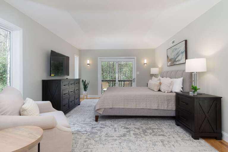 One of the upstairs bedrooms has its own private balcony with a seating area, allowing you to enjoy the outdoors privately–any time of day.