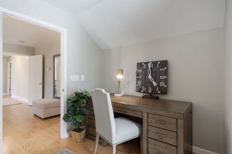 This dedicated workspace is in its own room, yet connects to the primary bedroom! Enjoy ample desk space and a comfortable chair.