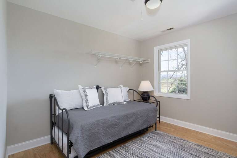 One of the king bedrooms contains a day bed with a twin trundle, which sleeps 2. This is also perfect for daytime reading with a view!