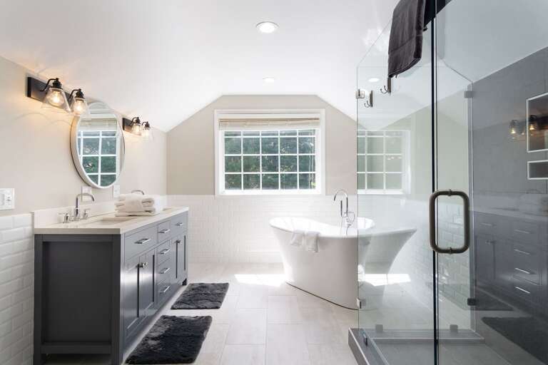 The primary bedroom's large walk-in shower, freestanding tub and large window make this ensuite bathroom a retreat in itself.