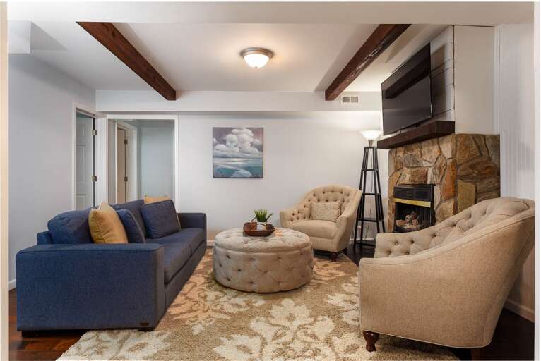 The lower level also has its own seating area, complete with a gas fireplace and 55” Roku HDTV. The lower level also has its own seating area, complete with a gas fireplace and 55” Roku HDTV.