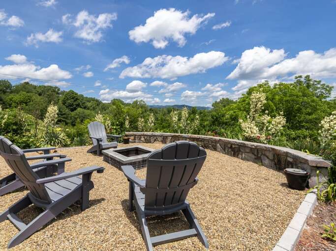 Outdoor Seating Area With Adirondack Chairs And Scenic View Outdoor Seating Area With Adirondack Chairs And Scenic View