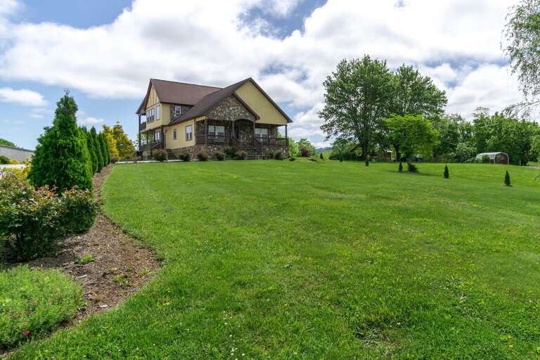 The oversized yard is the perfect setting for outdoor exercise, picnics and for the enjoyment of children and pets. The oversized yard is the perfect setting for outdoor exercise, picnics and for the enjoyment of children and pets.