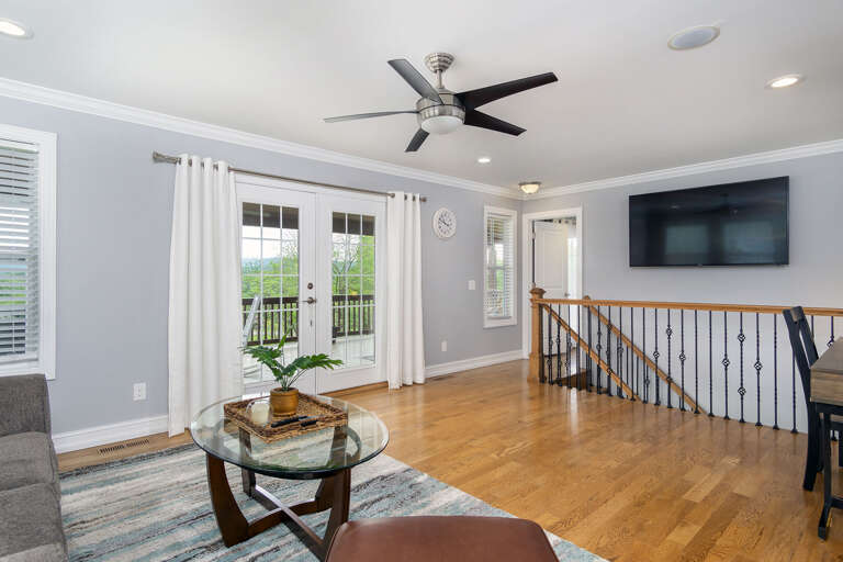 Step out to the upper deck from this sitting area and workspace to  greet the Blue Ridge Mountains every morning. Step out to the upper deck from this sitting area and workspace to  greet the Blue Ridge Mountains every morning.