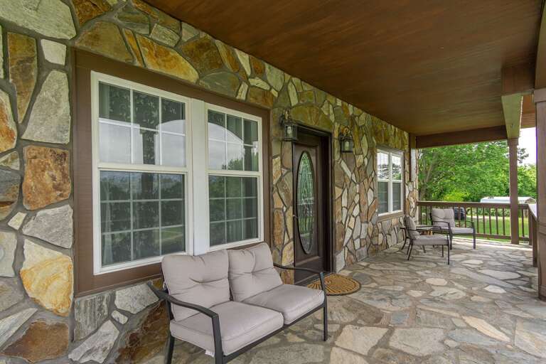 The stonework on the exterior of this house is a gorgeous display of craftsmanship. The stonework on the exterior of this house is a gorgeous display of craftsmanship.
