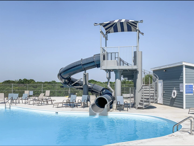Branson Cove's neighborhood outdoor swimming pool with super fun waterslide
