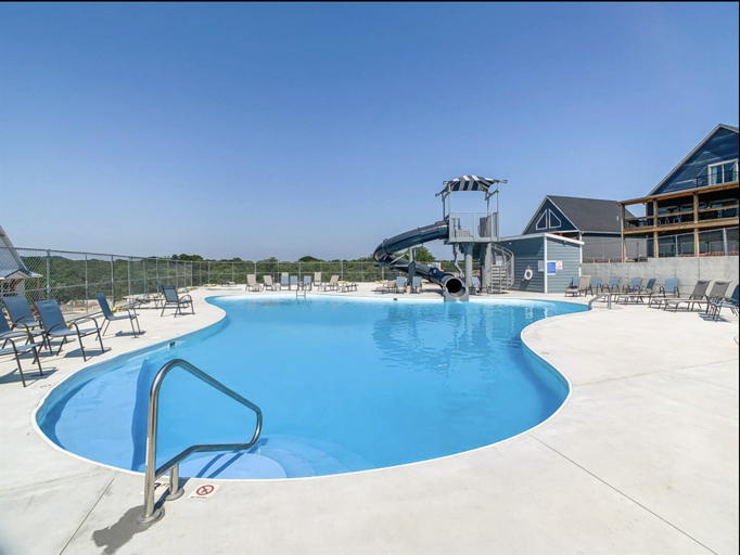 Neighborhood outdoor pool at Branson Cove is a short walk down the street