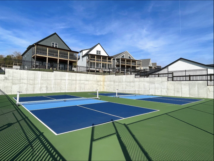 Neighborhood pickleball court next to the outdoor pool