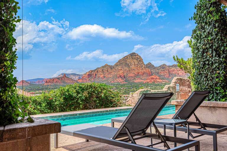 Poolside Loungers Overlooking Layered Landscape