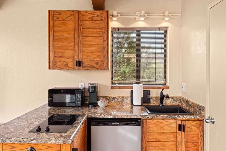 Prepare and Enjoy Movie Night Meals in the Home's Quaint Kitchenette.
