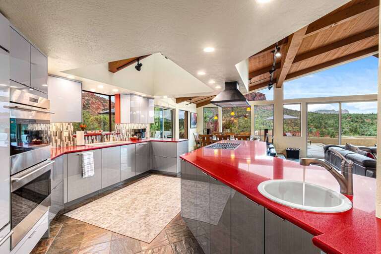 Spacious Chef's Kitchen with Large Island and Stunning Views.