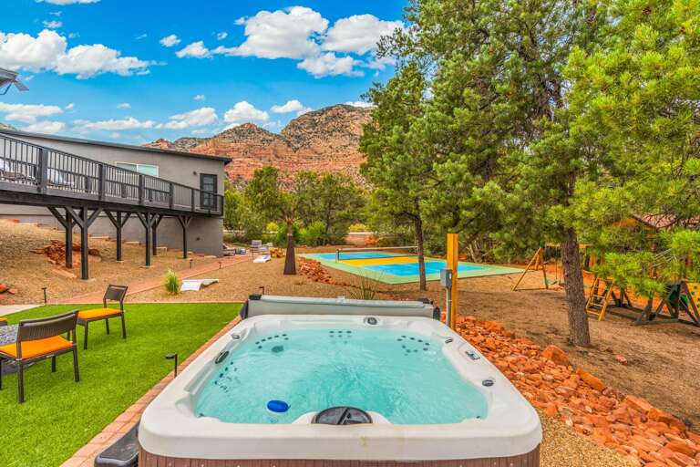 [Hot Tub] Soak in the relaxing six-person hot tub with a scenic red rock backdrop.