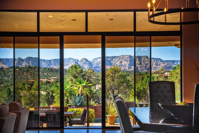 [Home 2] Telescopic glass doors showcasing a beautiful view of Sedona.