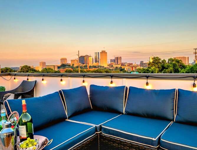 - Unwind on the spacious rooftop sectional while soaking in the city skyline at sunset - Twinkling string lights and plush seating create the perfect evening ambiance - Enjoy a chilled bottle of wine or cocktails with an unforgettable view  