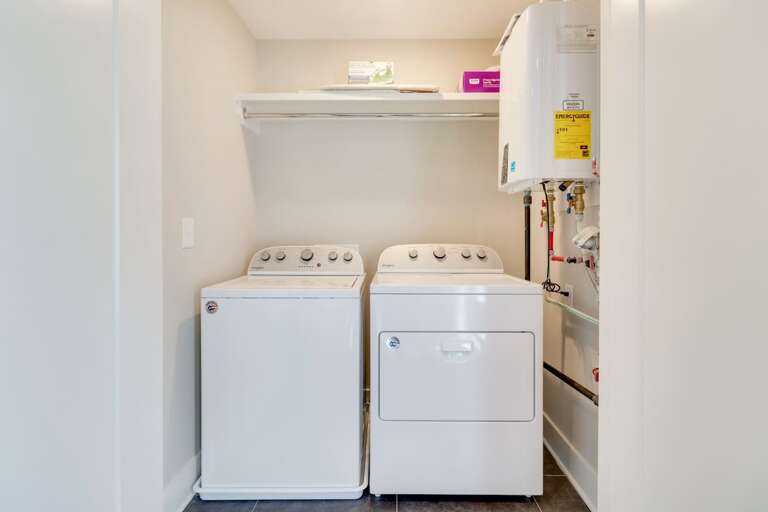 - Full size washer and dryer tucked into a dedicated laundry nook for guest use - Overhead shelf provides space for detergents, supplies, and quick organization - Perfect for long stays, beach trips, or keeping fresh towels ready anytime