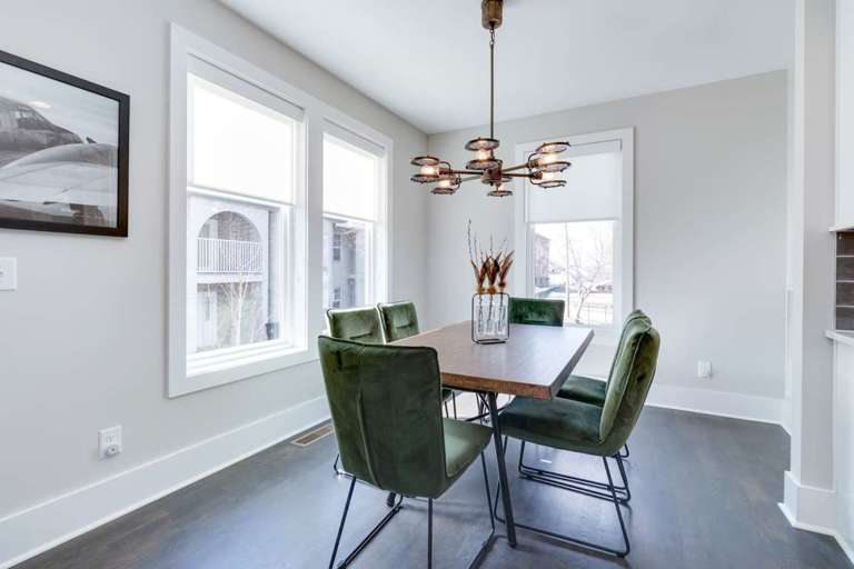 Dining area with seating for 6 under a mid-century chandelier