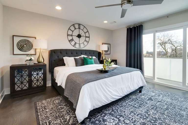 Master bedroom with a private, walk out balcony with downtown views Master bedroom with a private, walk out balcony with downtown views