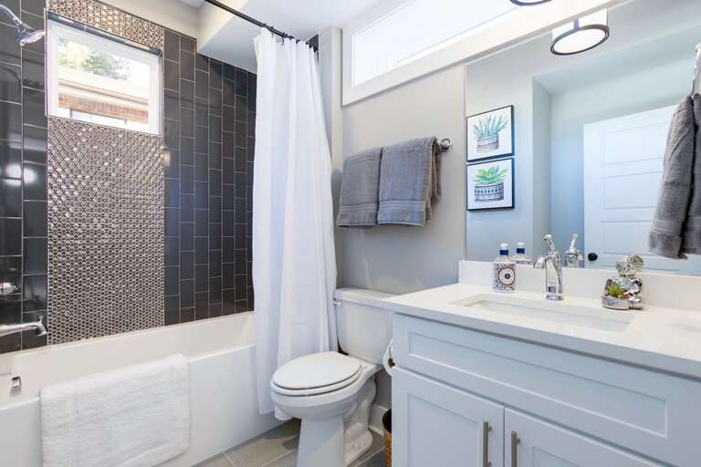 - Fresh, bright, and spa like, this bathroom blends style and comfort effortlessly - Sleek tilework, soft towels, and thoughtful touches make every refresh feel deluxe - Natural light and clean design create the perfect spot to start or end your day