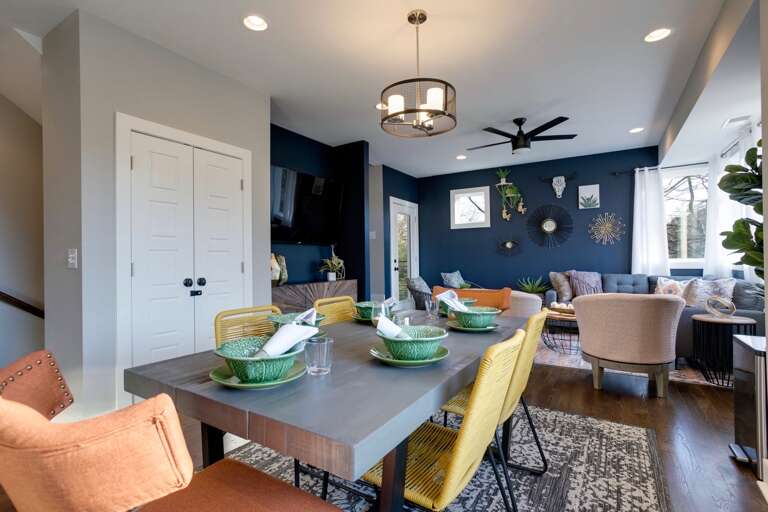 - Dine, laugh, and connect in this open concept space full of natural light - Eclectic seating and playful details make every meal feel like a celebration - Easy flow into the cozy living room, perfect for sharing moments and memories
