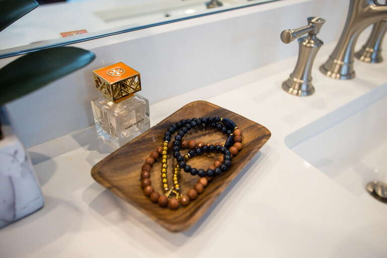 - Thoughtful touches like beads, fragrance, and natural wood add warmth and calm - Stylish vanity moment that blends beauty, simplicity, and personality - Small details make a big difference, this space invites you to slow down and enjoy