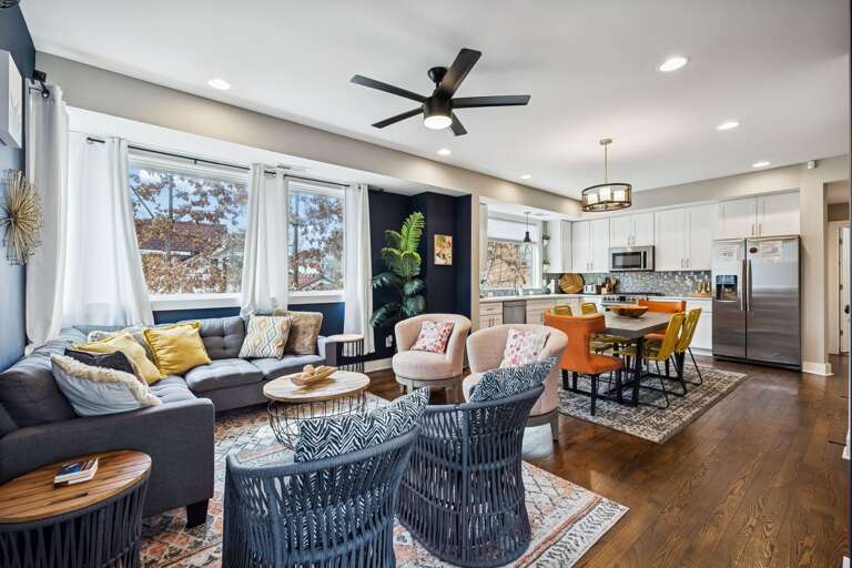 - Kick back in this bold, artful lounge with cozy textures & eye catching decor - Sunlight pours through wraparound windows, filling the space with warmth - Perfect for game nights, lazy mornings, or vibing with your favorite playlist