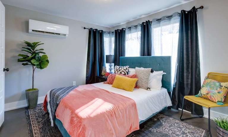 The first floor bedroom has blackout curtains