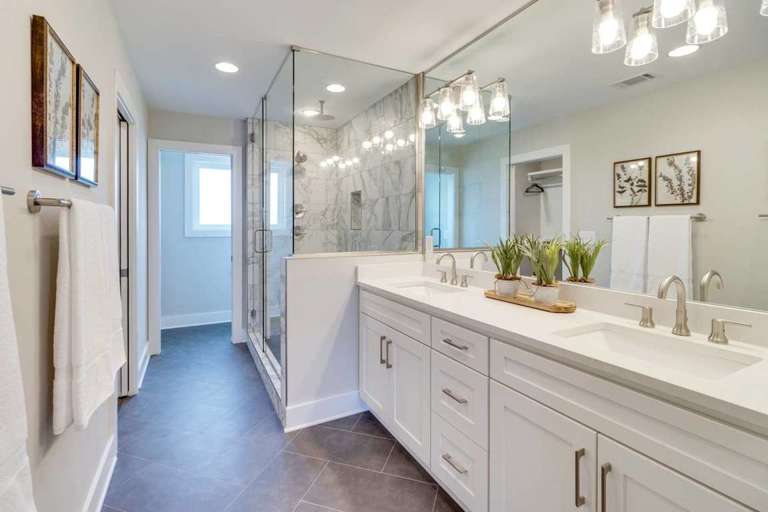 Master bathroom with counter to ceiling full length mirror