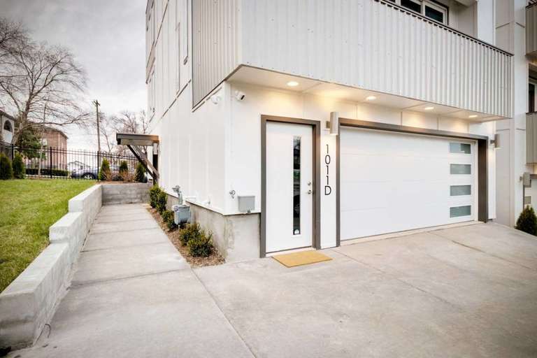 Garage 1 can accommodate two full-size cars and has an entrance for guests