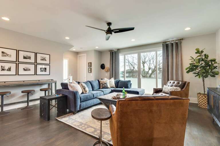 - Spacious seating area with plush sectional, leather chairs, &amp; stylish neutral decor - Natural light fills the room through large windows with views &amp; blackout curtains - Wall mounted art, cozy throw pillows, &amp; bar seating create a chic, soci