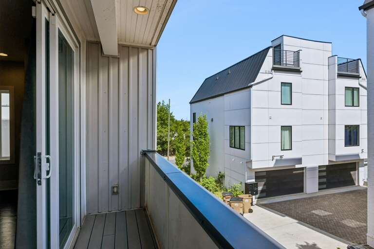 Settle into a space that was designed to actually be lived in — every angle of this living room patio gives you somewhere to land after a long night out.