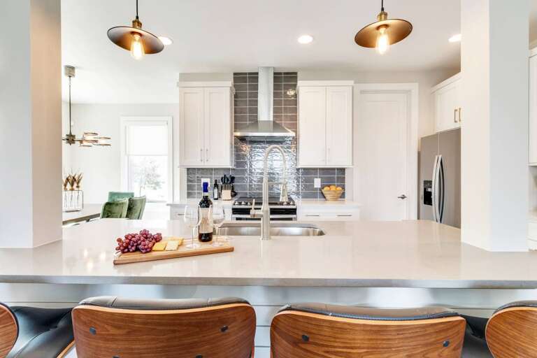 - Kitchen island with comfy bar seating, perfect for sipping wine or enjoying breakfast - Stainless steel finishes &amp; a deep farmhouse sink bring modern function to every meal - Set the tone for your stay with grapes, cheese, &amp; a welcoming bottle o