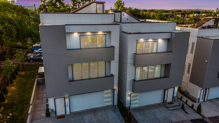 Welcome to Music City Modern! 2 Homes located side by side sleeping up to 20 guests! 2 Large Rooftop Decks offering amazing views of the Nashville skyline!