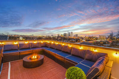 - Watch the sun dip behind the skyline from your rooftop fire pit lounge - Cozy seating, twinkle lights, and stunning views, this is the spot everyone talks about - Perfect for wine nights, late laughs, and sky gazing sessions with friends