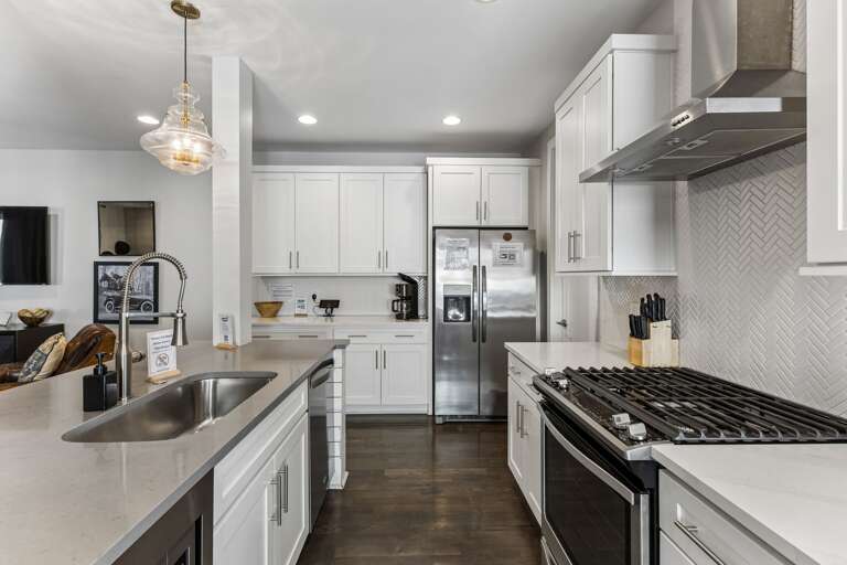 Cook for the whole group without feeling cramped — island with sink, full-size appliances, and enough counter space to actually prep a real meal.