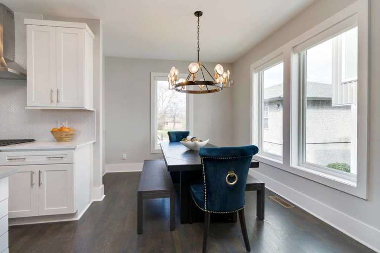 Dining area with seating for 8 under a mid-century chandelier