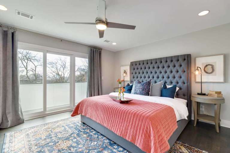 Master bedroom with a private, walk out balcony with downtown views
