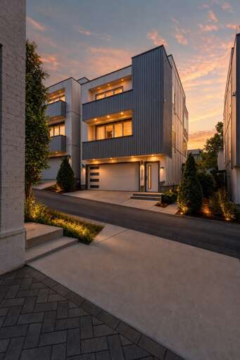 Step up at dusk and the building makes its own statement — four levels lit against the Nashville sky before you even walk in the front door.
