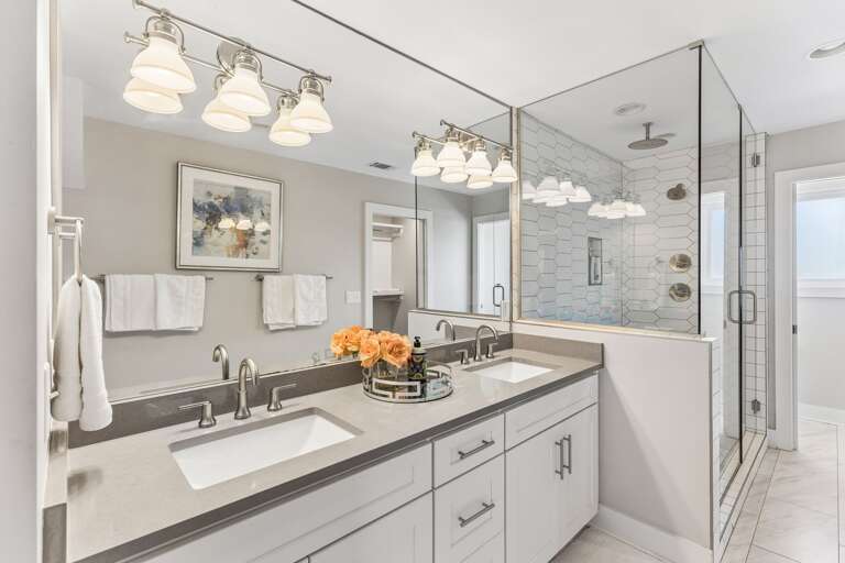 Share the master ensuite without the wait — double vanity, quartz counters, and enough mirror space so no one's elbowing anyone out of the way.