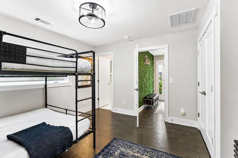Sleep in, close the closet, and take your time — the second bunk room has space for four without feeling like a hostel.