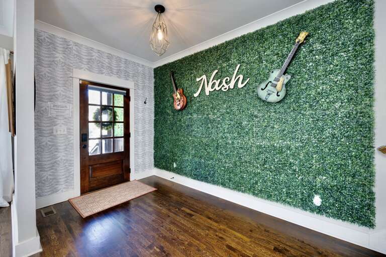 Entry foyer with custom Nash wall perfect for your next viral social media post!