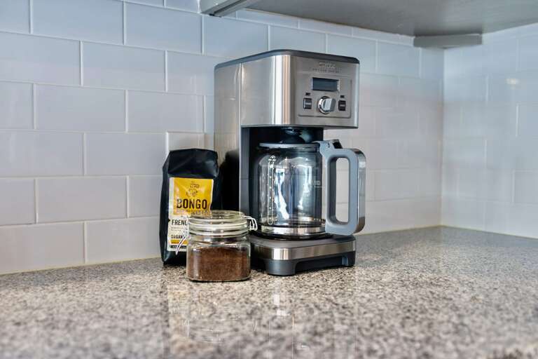 - Enjoy a fresh morning brew with the sleek stainless-steel coffee maker provided - Includes exclusive Bongo French Roast beans and ground coffee in a glass jar - Conveniently located on the granite counter for easy access