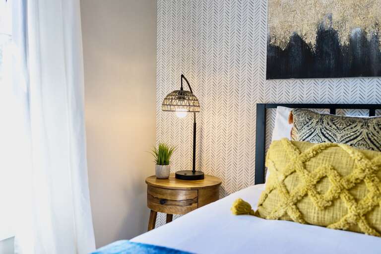 - Soft light, warm wood, and curated details make this space feel instantly relaxing - Wake up to natural sunlight or wind down with a glow that’s just right - Every detail adds a touch of calm, from the woven lamp to the cozy bedding blend