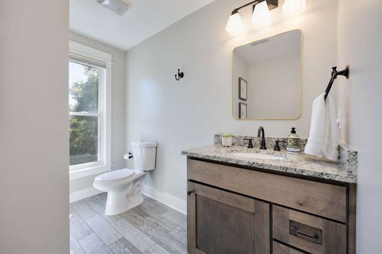 - Start your day with sunlight and sleek finishes in this bright, refreshing space - Granite vanity, bold black fixtures, and a mirror that sets the vibe - Clean, calming, and perfect for a quick refresh or slow self care moments  