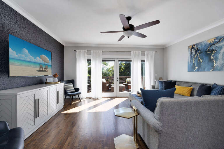 - Slide into comfort with a plush sectional, cozy throws, & a vibe that says stay awhile - Open the doors, feel the breeze, & step straight onto your sunny deck escape - Movie nights, lazy mornings, or game day hangs, this is your go to chill zone