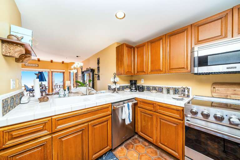 Spacious and updated kitchen opens to the family room and offers a new stainless steel suite of Viking appliances.  Spacious and updated kitchen opens to the family room and offers a new stainless steel suite of Viking appliances.