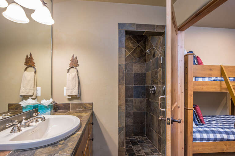 The bunk room has a fun walk-in shower | Lower Level