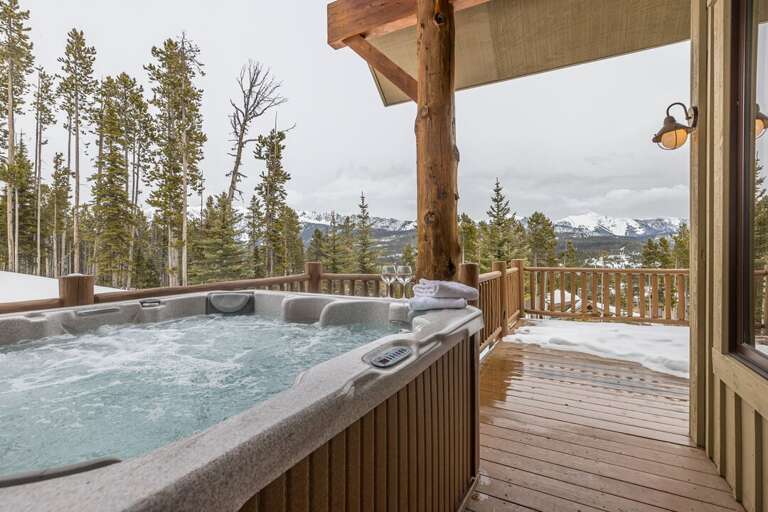It may get cold outside, but the hot tub is nice and warm | Main Level