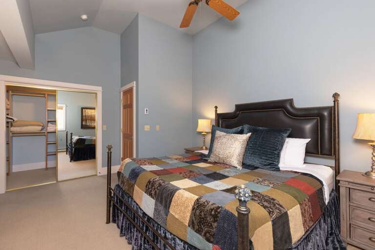 Get comfy in the king-sized bed | Master Bedroom | King-Sized Bed | Upper Level
