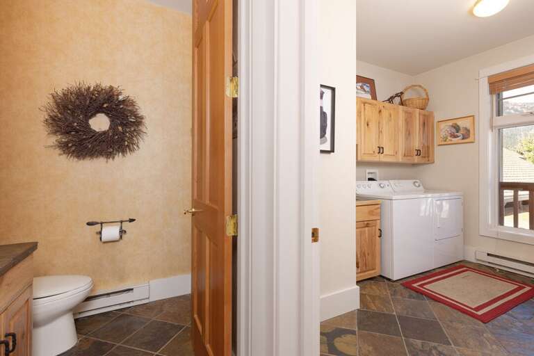 Convenient half-bathroom and laundry room | Main Level