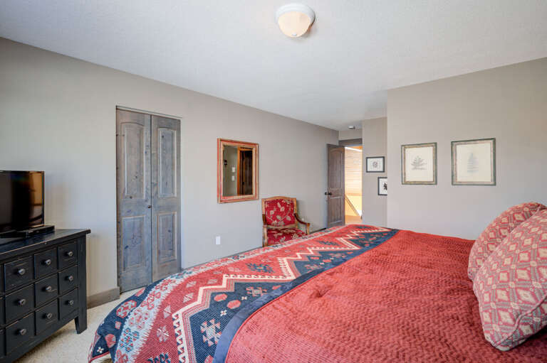 Get comfy in the king-sized bed | King-sized bed | Upper Level